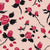 Viva Magenta roses with black leaves and thorns, on apricot background Image
