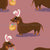 Easterweenie Wiener dog with easter basket on a dusky pink background - easter egg sausage dog Image