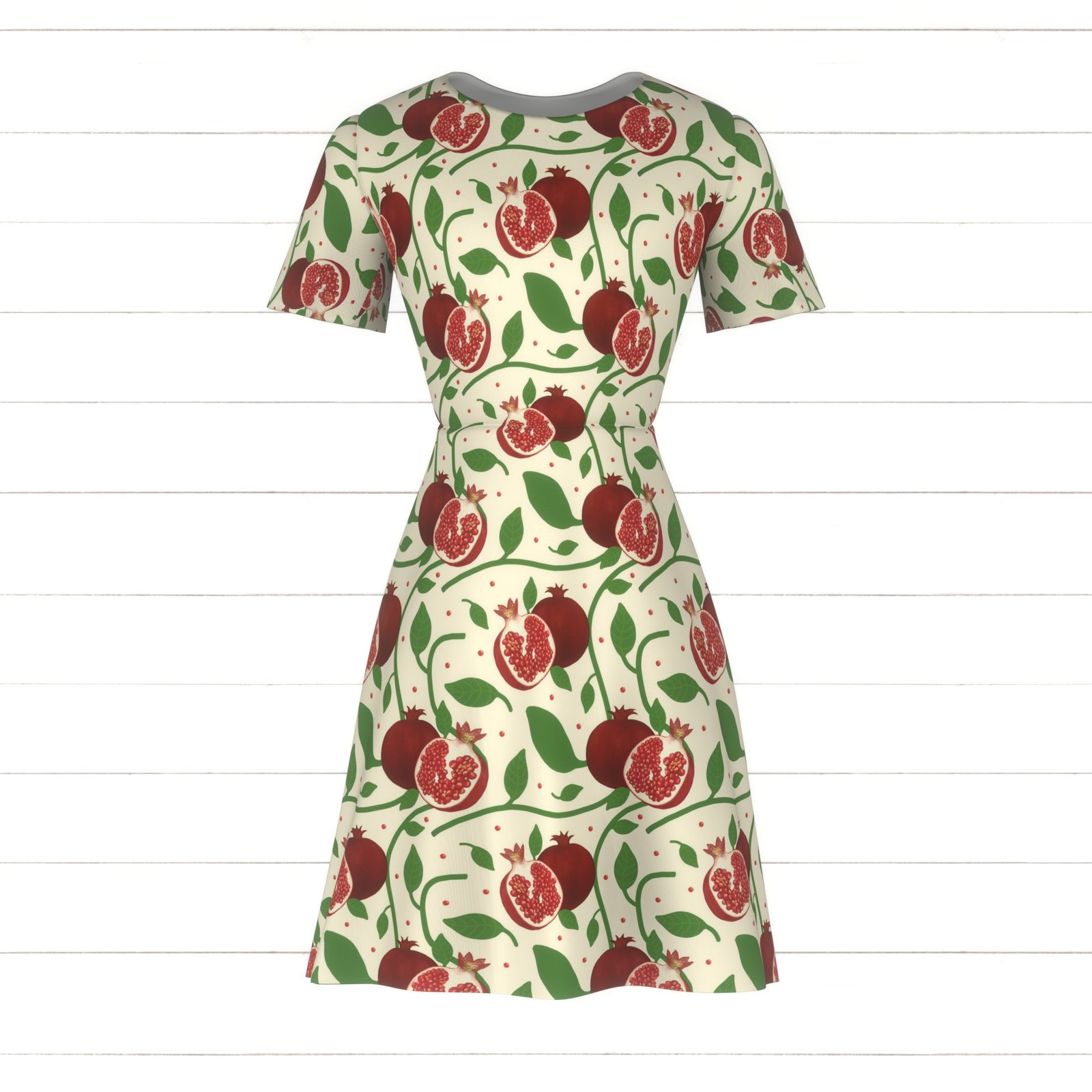 Red Pomegranates and Green Botanicals on Cream