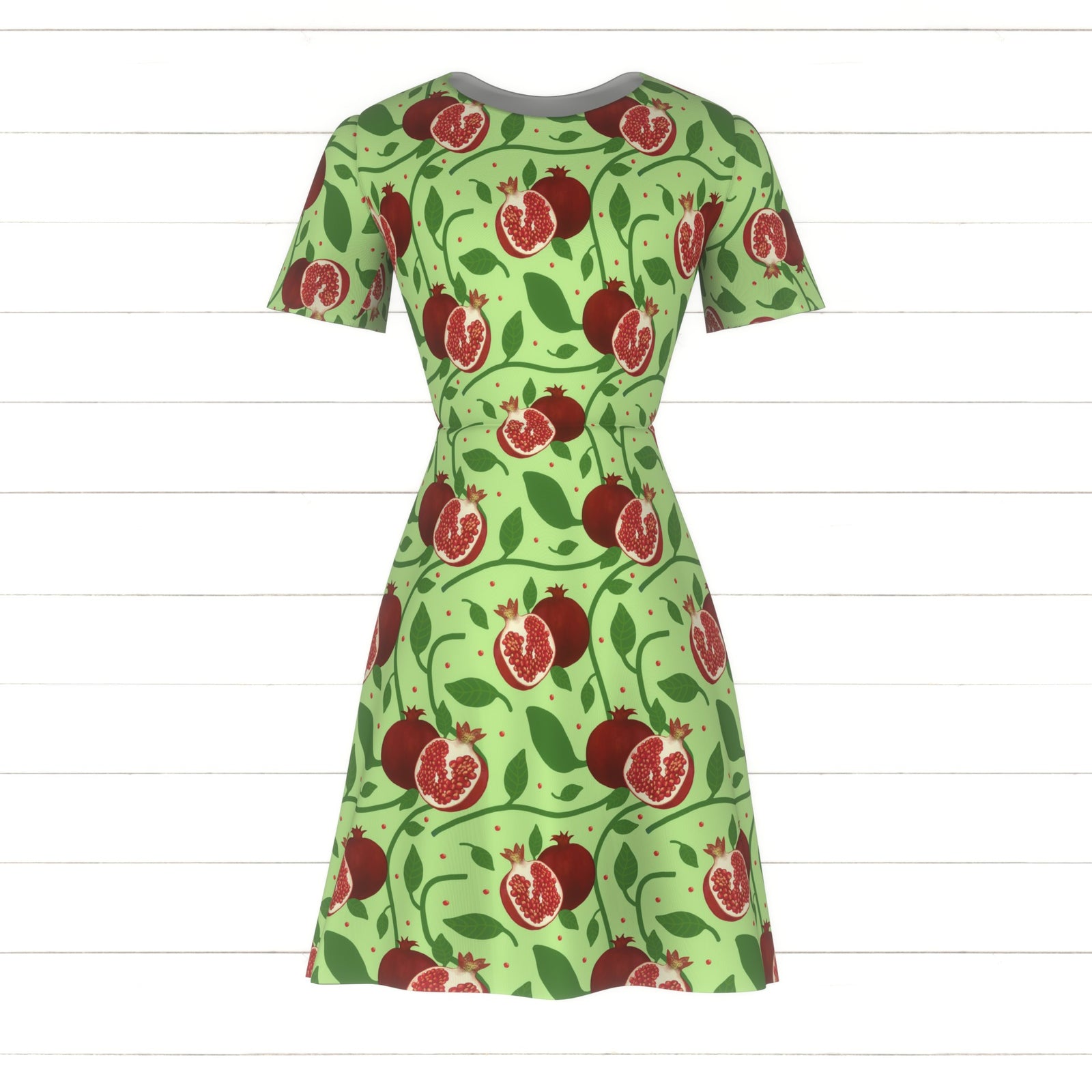 Red Pomegranates and Botanicals on Light Green