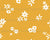 White Flower Sprinkles on Honey Yellow - Flower Sprinkles Image