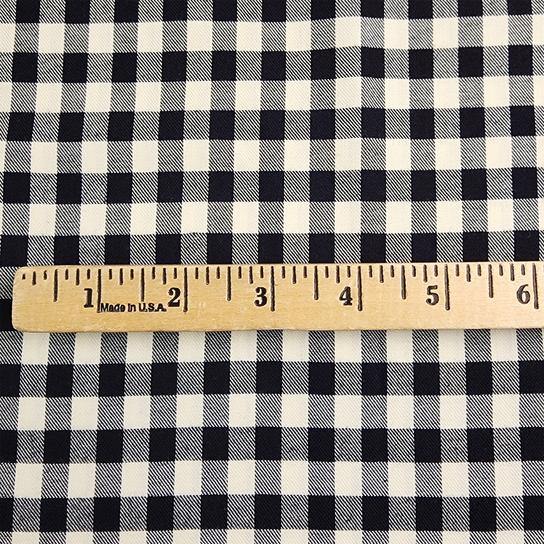 Black and Cream Small Buffalo Check Flannel Shirting with ruler