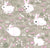 Baby Collection: White bunnies graze on the green grass and nibble pink flowers. Image